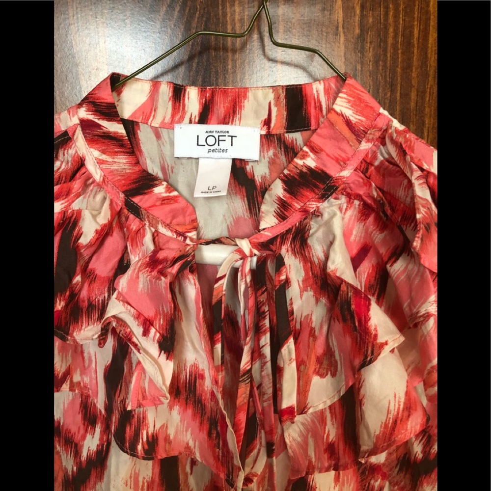 100% silk top. Red, pink, black, white. Sleeveless